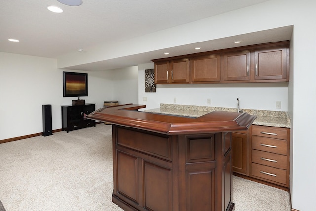 bar featuring recessed lighting, light colored carpet, wet bar, and baseboards