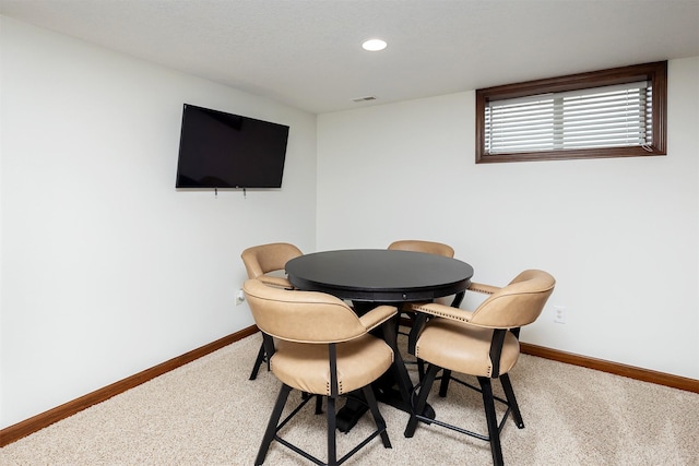 dining room with recessed lighting, visible vents, baseboards, and light carpet