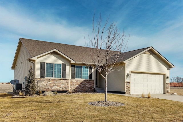 ranch-style home with driveway, an attached garage, a shingled roof, a front lawn, and stone siding