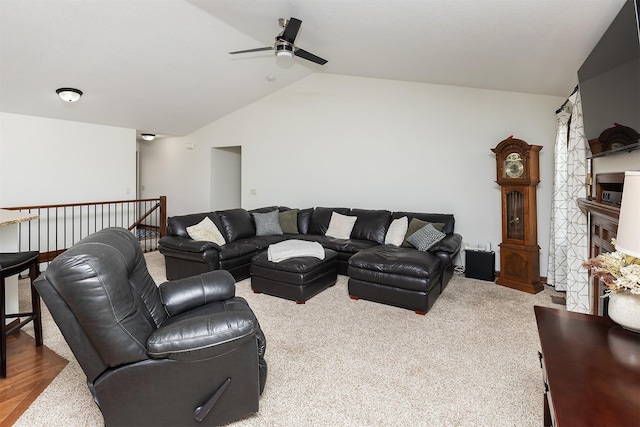 living area with lofted ceiling and a ceiling fan