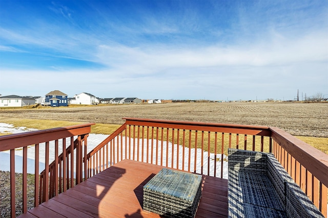 wooden deck with a yard and a residential view