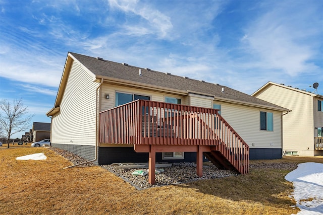 back of house featuring stairway, a yard, and a wooden deck