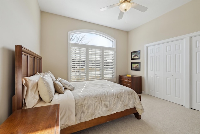 bedroom with a ceiling fan, a closet, and carpet floors