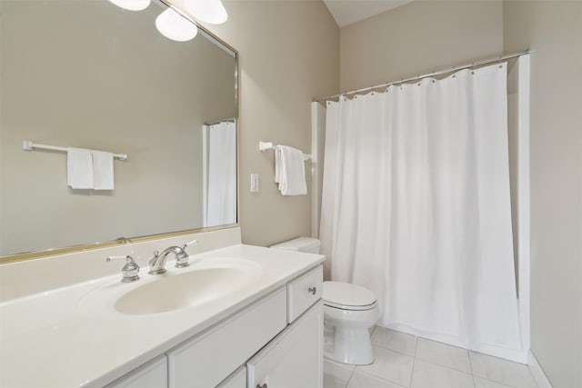 full bathroom featuring tile patterned flooring, a shower with shower curtain, toilet, and vanity