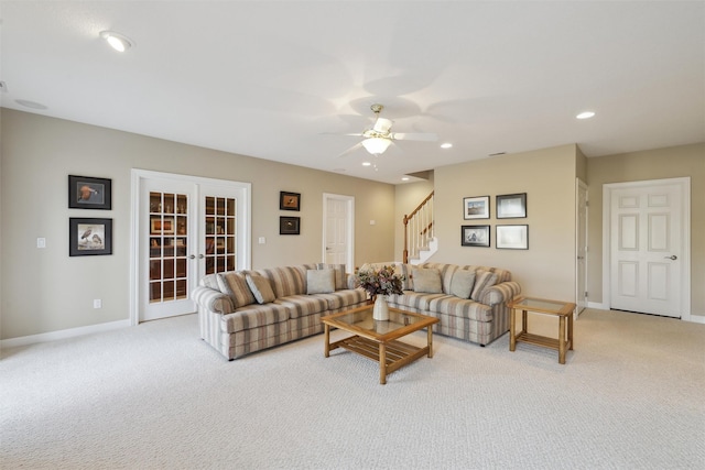 living area with stairway, baseboards, recessed lighting, french doors, and light carpet