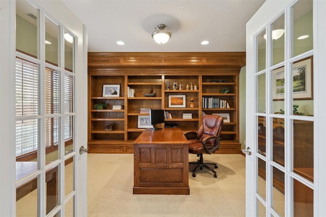 office space featuring recessed lighting, french doors, and light carpet