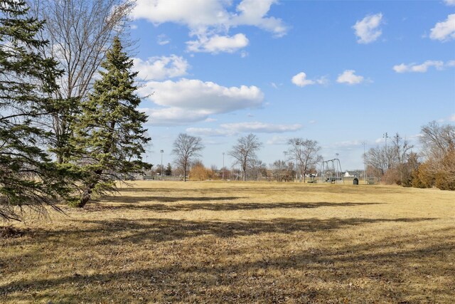 view of yard with a rural view