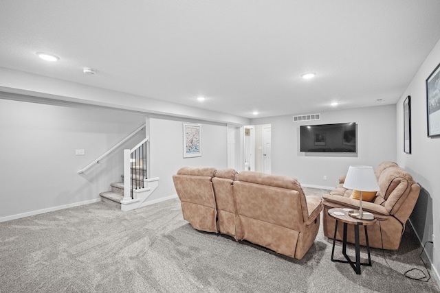 carpeted living area featuring recessed lighting, visible vents, baseboards, and stairway