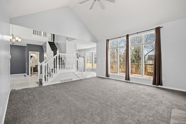 unfurnished living room featuring visible vents, high vaulted ceiling, stairs, and carpet