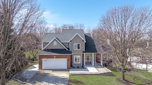 view of front of home with driveway, roof with shingles, an attached garage, a front lawn, and brick siding