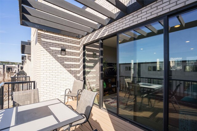 1343 Keosauqua Way, Des Moines, IA 50309 - wooden deck featuring a pergola and outdoor dining space