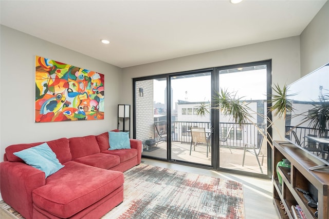 1343 Keosauqua Way, Des Moines, IA 50309 - living area featuring wood finished floors and recessed lighting