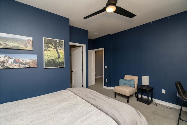 carpeted bedroom with baseboards and ceiling fan