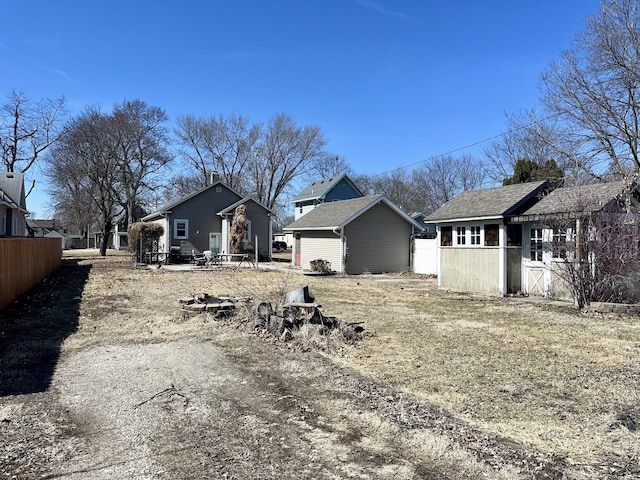 rear view of property with fence