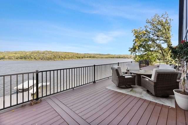 wooden deck with a water view