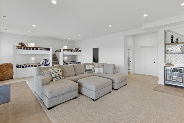 carpeted living room with wine cooler, recessed lighting, and a dry bar