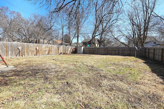 view of yard with a fenced backyard