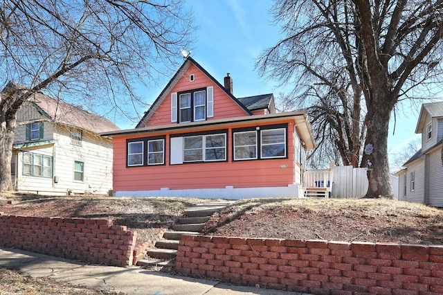 view of front of home featuring a chimney