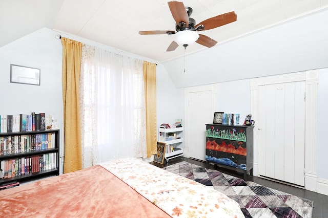 bedroom with lofted ceiling and a ceiling fan