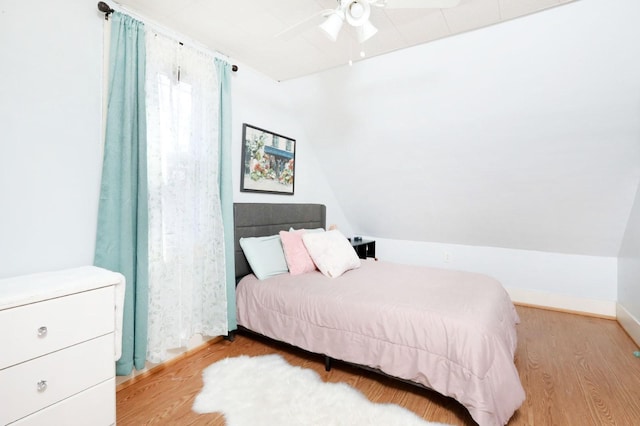 bedroom with wood finished floors and a ceiling fan