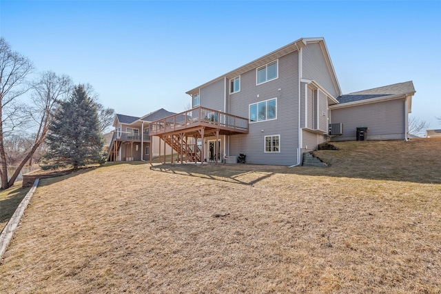 rear view of property with central air condition unit, a lawn, a deck, and stairs