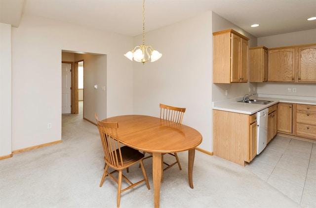 kitchen with recessed lighting, dishwasher, light countertops, and baseboards