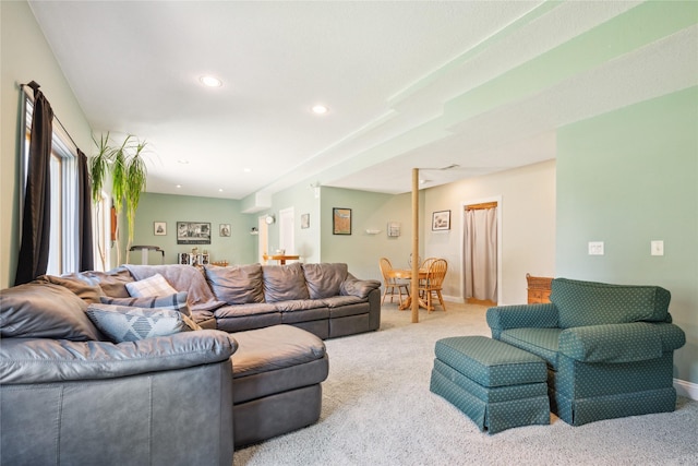 carpeted living room with recessed lighting and baseboards