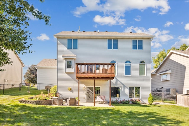 rear view of house with a fenced backyard, a patio, and a yard