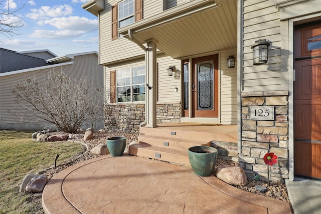 view of exterior entry with stone siding