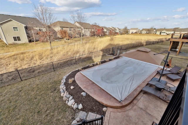 view of yard with a residential view and fence