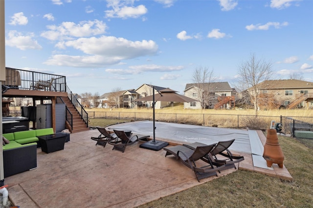 view of patio with stairway, a residential view, and a fenced backyard