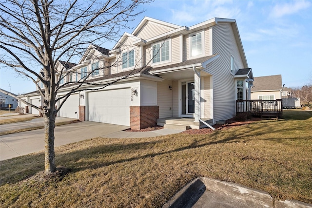 view of front of property with a garage, a front yard, brick siding, and driveway