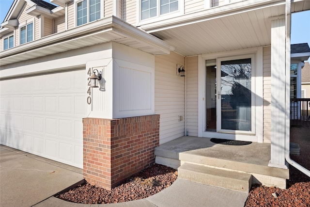 doorway to property featuring a garage