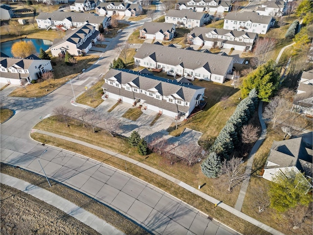 aerial view featuring a residential view and a water view