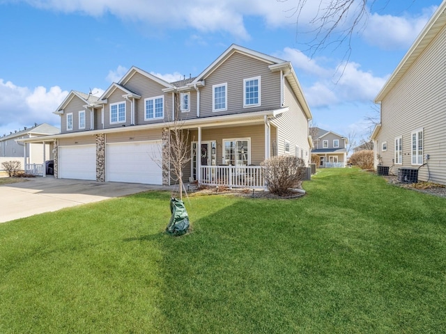 view of front of property featuring driveway, an attached garage, covered porch, a front lawn, and central air condition unit