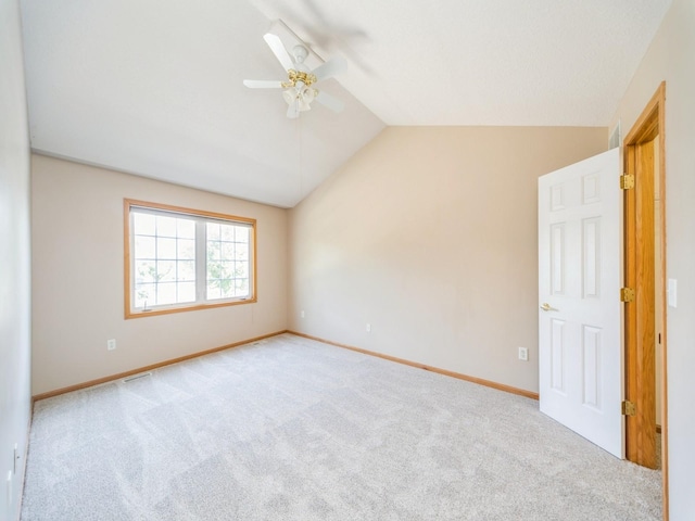 1904 NW Ashton Ln Unit 3, Ankeny, IA 50023 - unfurnished bedroom with lofted ceiling, carpet, and ceiling fan