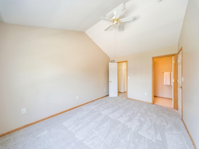 1904 NW Ashton Ln Unit 3, Ankeny, IA 50023 - unfurnished bedroom with vaulted ceiling, carpet flooring, a ceiling fan, and ensuite bathroom