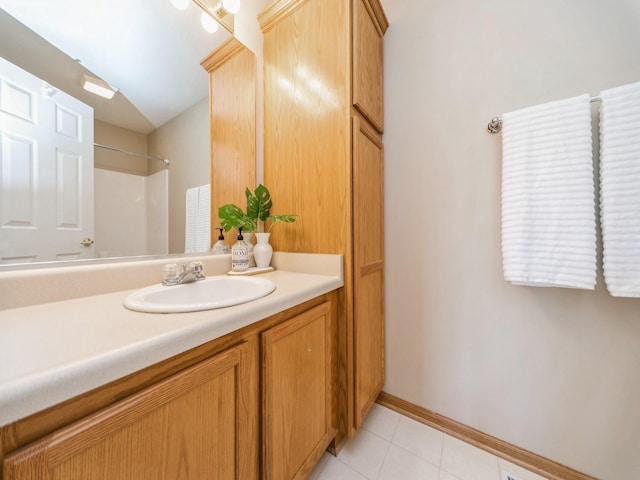 1904 NW Ashton Ln Unit 3, Ankeny, IA 50023 - bathroom featuring vanity, tile patterned floors, and a shower