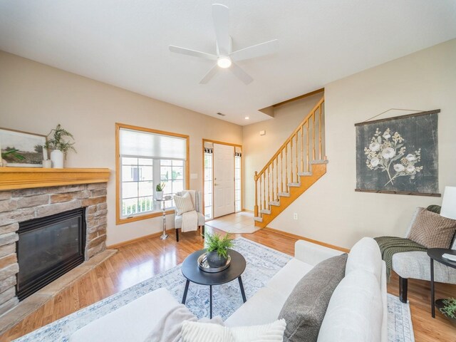 1904 NW Ashton Ln Unit 3, Ankeny, IA 50023 - living area featuring stairs, wood finished floors, and a fireplace