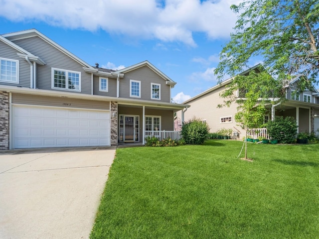 1904 NW Ashton Ln Unit 3, Ankeny, IA 50023 - view of front of property featuring concrete driveway, a front yard, a porch, and a garage