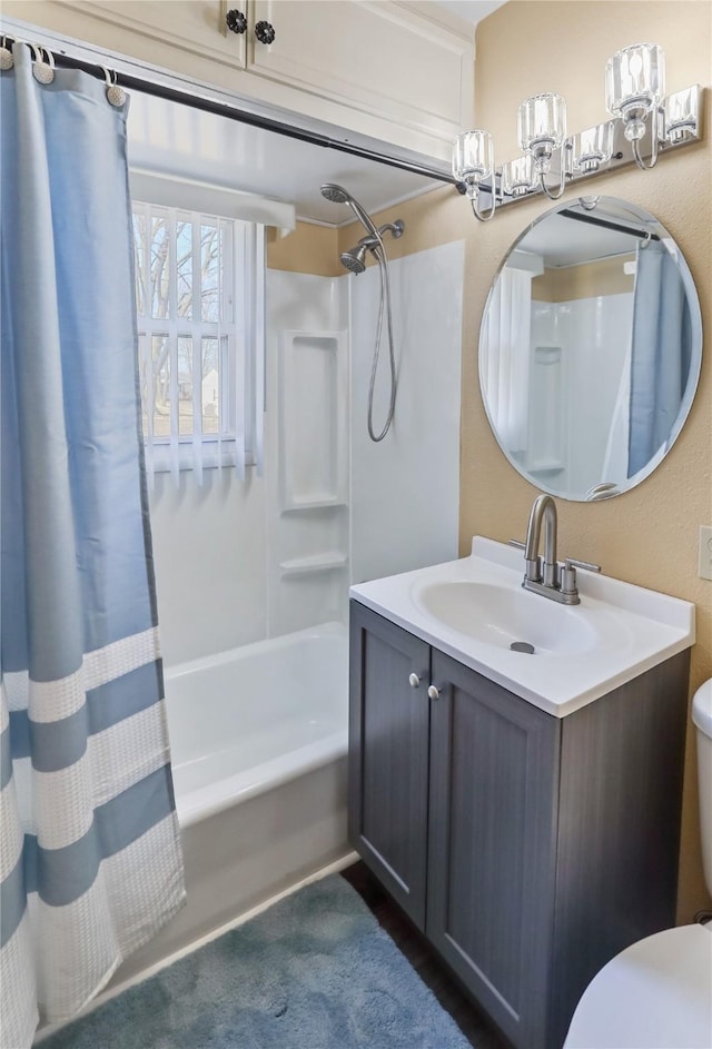 full bath with vanity, toilet, and shower / tub combo