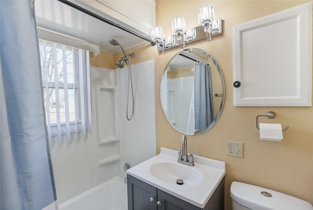 full bath featuring vanity, toilet, a textured wall, and shower / bath combo with shower curtain