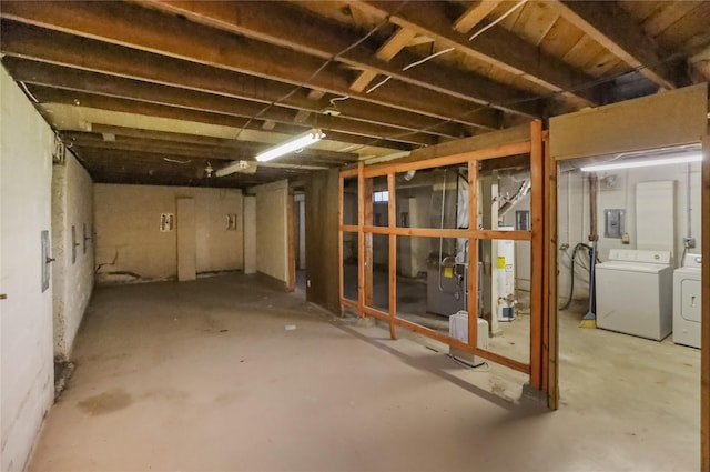 unfinished basement featuring washing machine and dryer