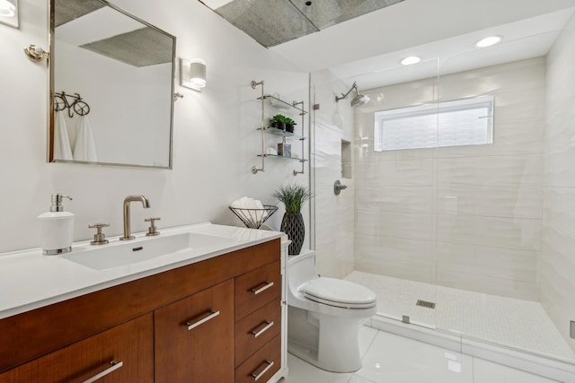 bathroom featuring tile patterned flooring, a shower stall, toilet, and vanity