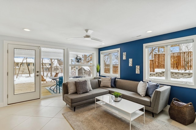 living room featuring a ceiling fan, light tile patterned flooring, recessed lighting, and visible vents