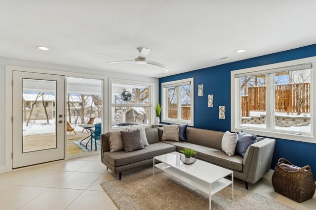 5740 Walnut Hill Ave, Des Moines, IA 50312 - living area with light tile patterned floors, a ceiling fan, and recessed lighting