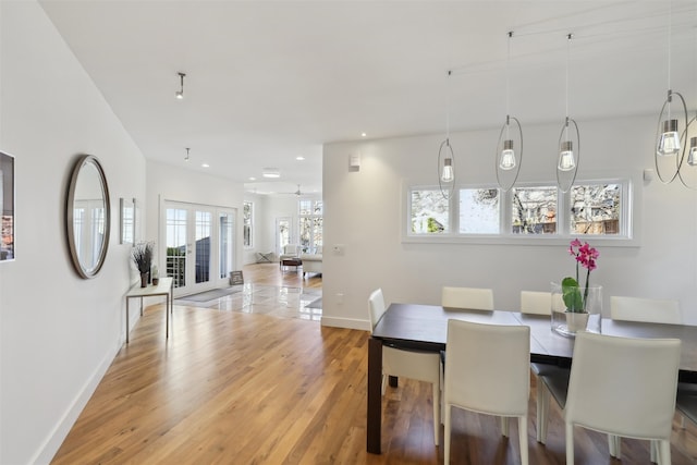 dining space featuring recessed lighting, french doors, baseboards, and light wood finished floors