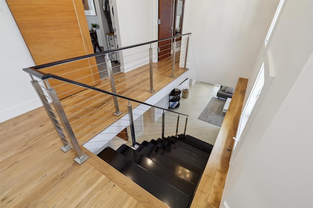 stairway featuring tile patterned floors