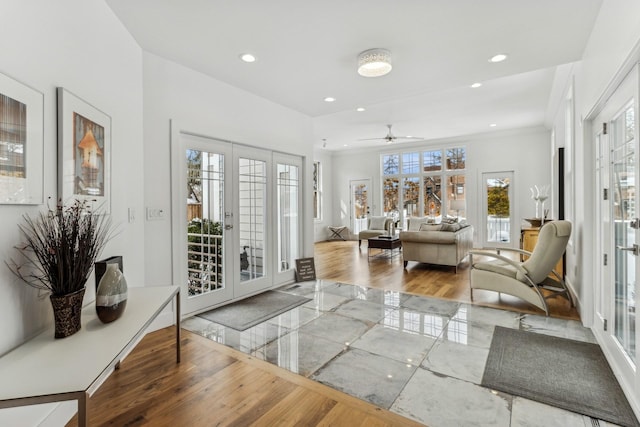 interior space featuring a ceiling fan, baseboards, recessed lighting, french doors, and crown molding