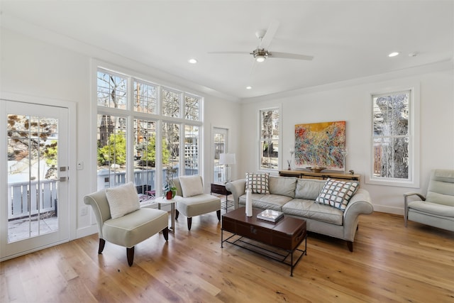 living area with recessed lighting, baseboards, light wood-style floors, and ceiling fan